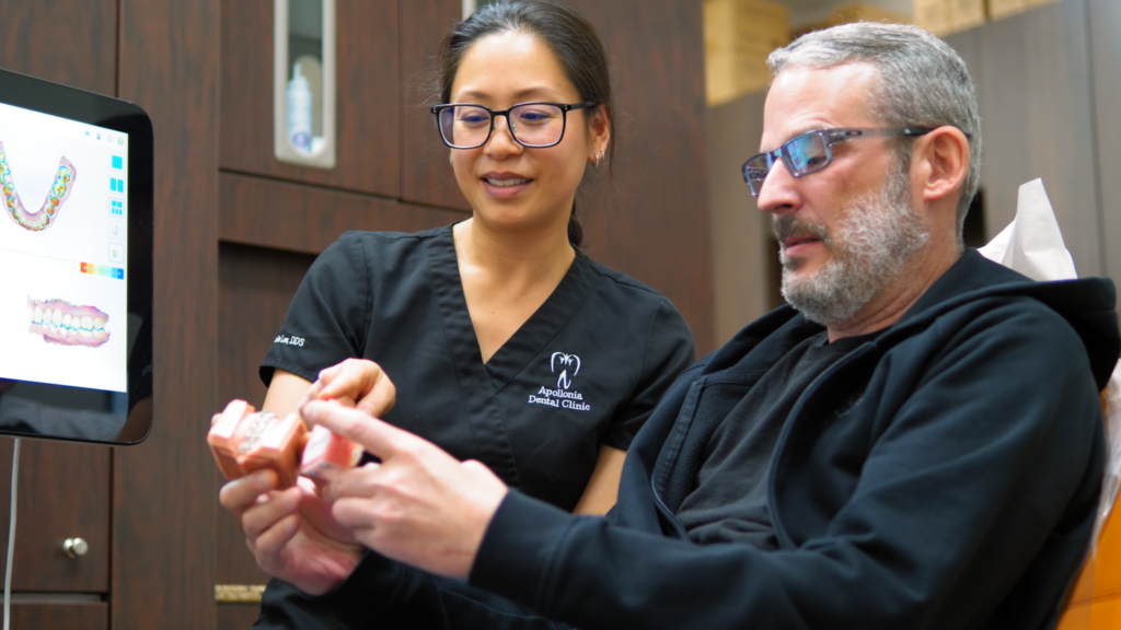 Dentist explaining the procedure to patient before a restorative filling