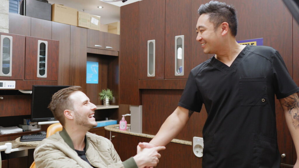 Dentist welcoming a patient at Apollonia Dental Clinic