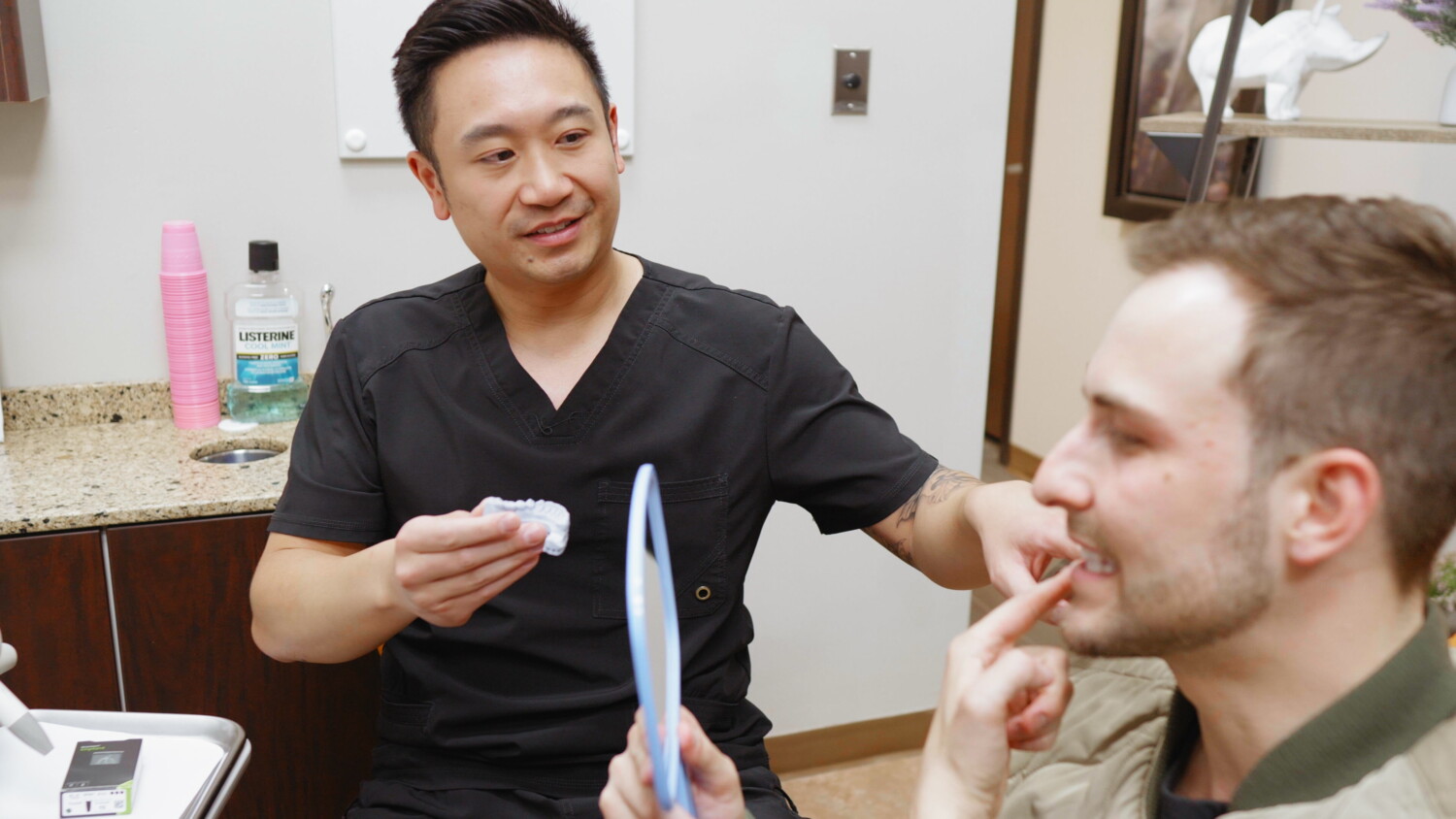 Dentist discussing dental treatment with a patient at Apollonia Dental Clinic Edmonton